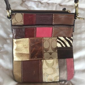 Coach multi-pattern block cross-body purse.